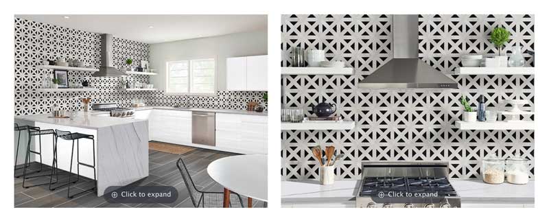 A modern kitchen featuring white cabinets, a granite-topped island with stools, and a distinctive geometric patterned tile backsplash.